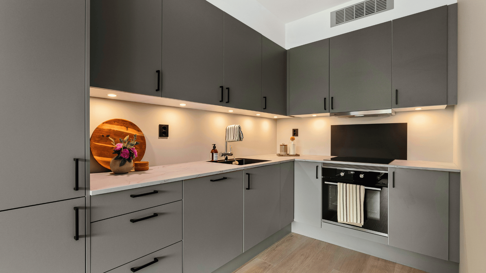 Kitchen cabinet painting project underway in Winnipeg home