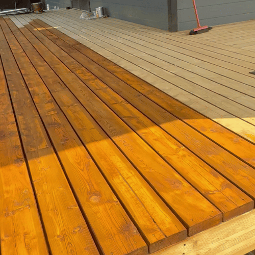 Restored deck after stripping and staining by Stephen's Edge Painting